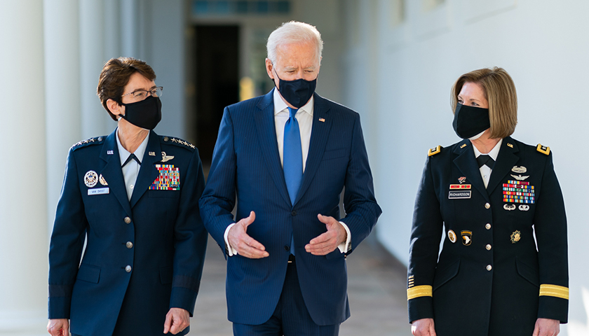 President Joe Biden walks along the Colonnade with the Combatant Commander nominees U.S. Air Force Gen. Jacqueline Van Ovost and U.S. Army Lt. Gen. Laura Richardson on Monday, March 8, 2021, along the Colonnade of the White House.