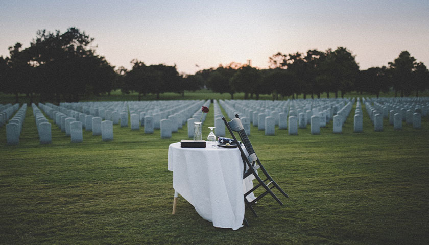 Veteran cemetery with table set for lives lost who served America