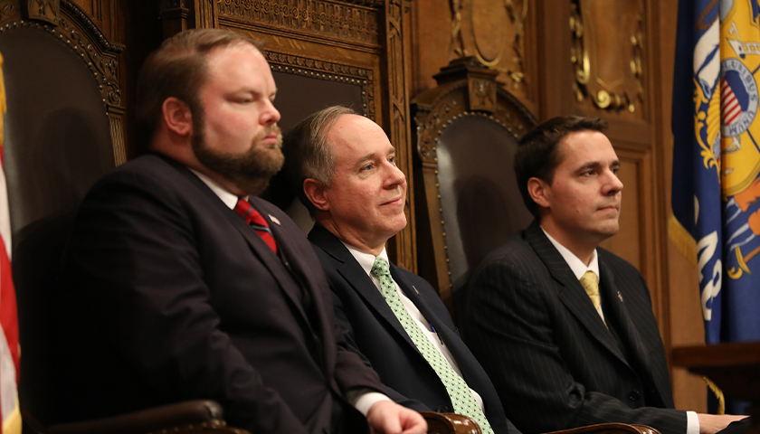 Governor Tony Evers gives his first State of the State address in Madison, Wisconsin, at the State Capitol building on Jan. 22, 2019. He addressed a joint meeting of the Assembly and the Senate. Seen here, from left, are Speaker Pro Tempore Rep. Tyler August, R-Lake Geneva, Assembly Speaker Robin Vos, R-Rochester and President of the Senate Roger Roth, R-Appleton.