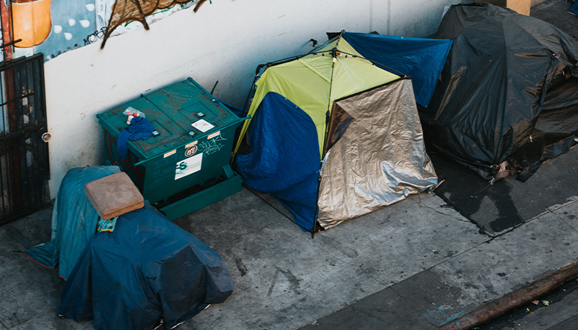 Several tents on the side of the street