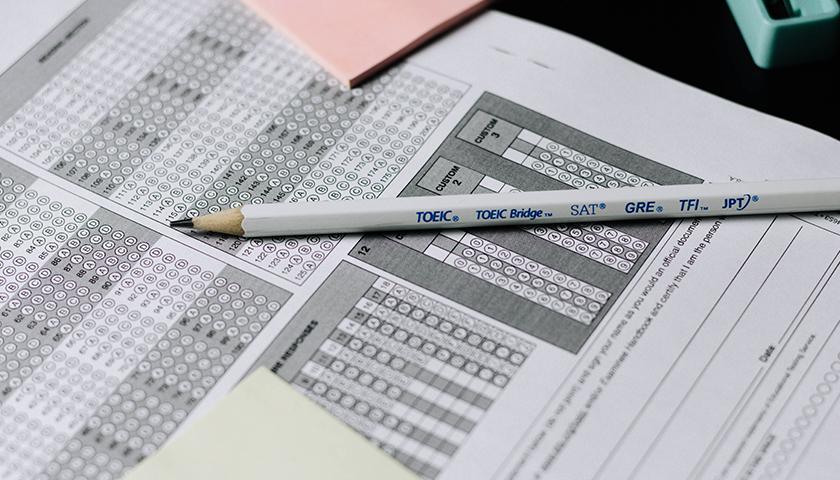 Close up of a pencil on top of a multiple choice exam paper