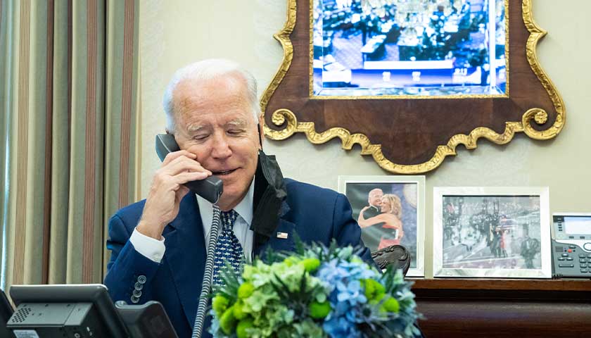 President Joe Biden talks on the phone with Senator Rob Portman, R-Ohio, following the Senate vote to pass the $1.2 trillion infrastructure bill, Tuesday, August 10, 2021, in the Oval Office Dining Room of the White House. (Official White House Photo by Adam Schultz)