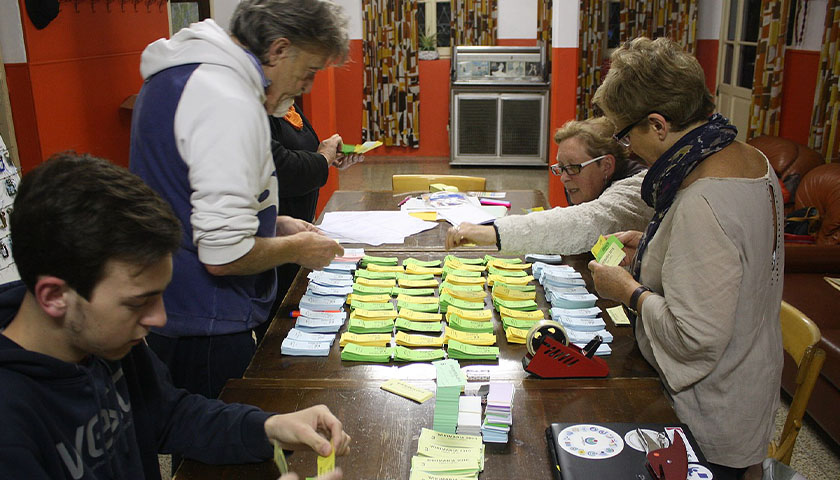 Volunteers sorting through food stamps